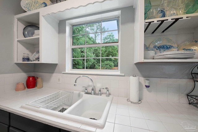 interior space featuring sink and tile counters