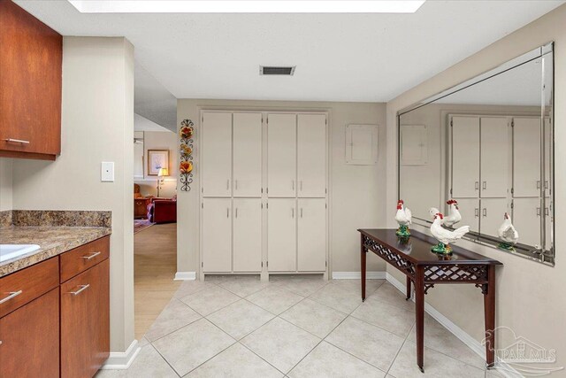 kitchen featuring white cabinets and light hardwood / wood-style floors