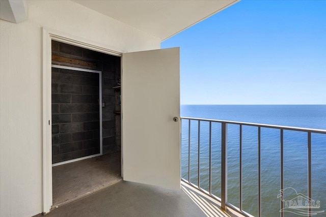 balcony featuring a water view