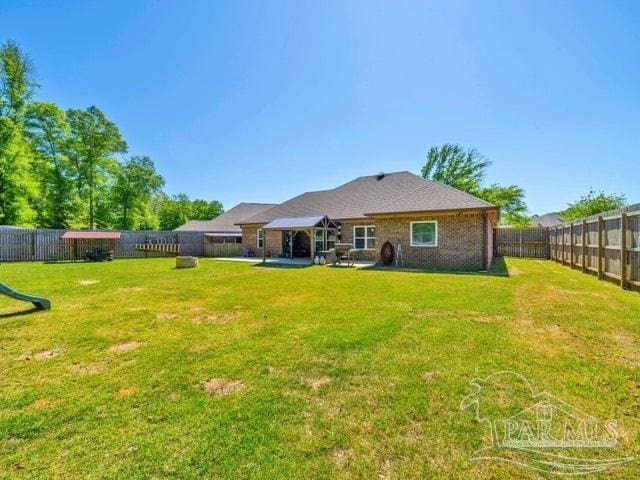 1516 Cadence Loop, Cantonment, FL 32533 - back of property featuring a gazebo and a patio