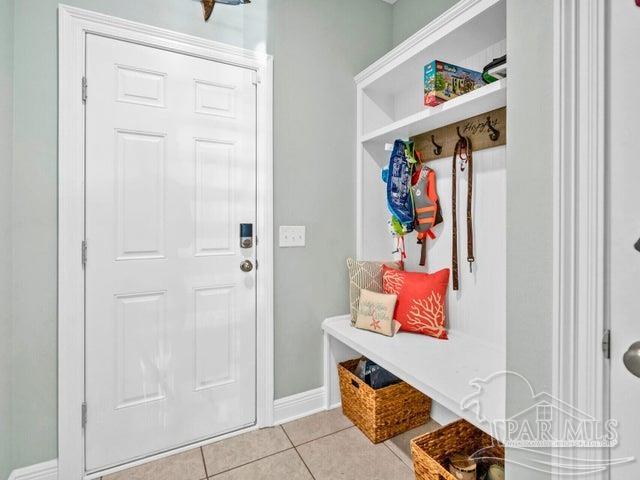 1516 Cadence Loop, Cantonment, FL 32533 - mudroom with light tile patterned floors and baseboards