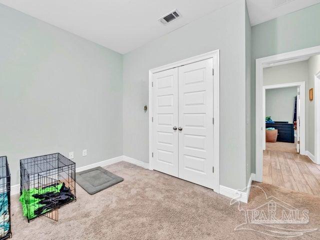 1516 Cadence Loop, Cantonment, FL 32533 - game room with baseboards and carpet floors
