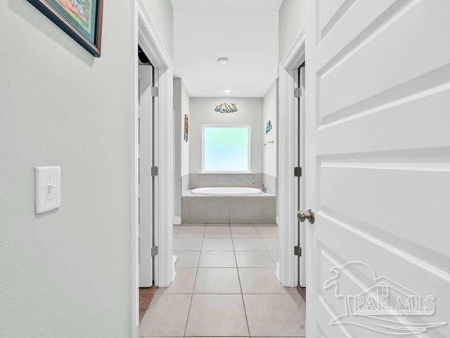 1516 Cadence Loop, Cantonment, FL 32533 - hallway featuring light tile patterned floors