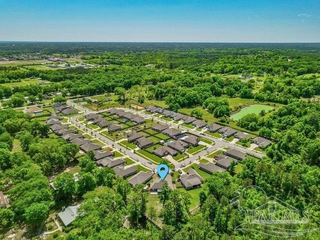 1516 Cadence Loop, Cantonment, FL 32533 - aerial view of property and surrounding area featuring nearby suburban area and a heavily wooded area