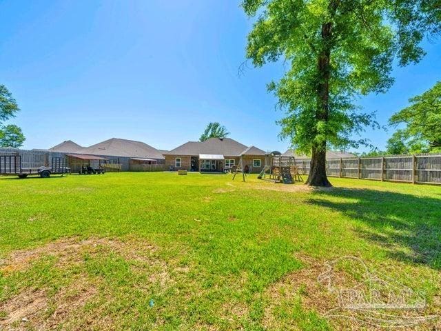 1516 Cadence Loop, Cantonment, FL 32533 - view of yard featuring a playground