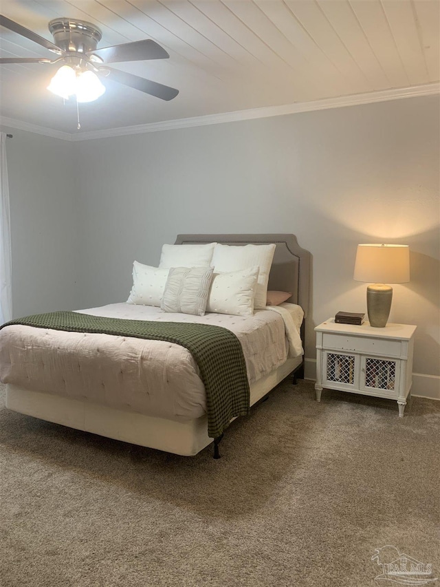 carpeted bedroom featuring ceiling fan, wood ceiling, and crown molding