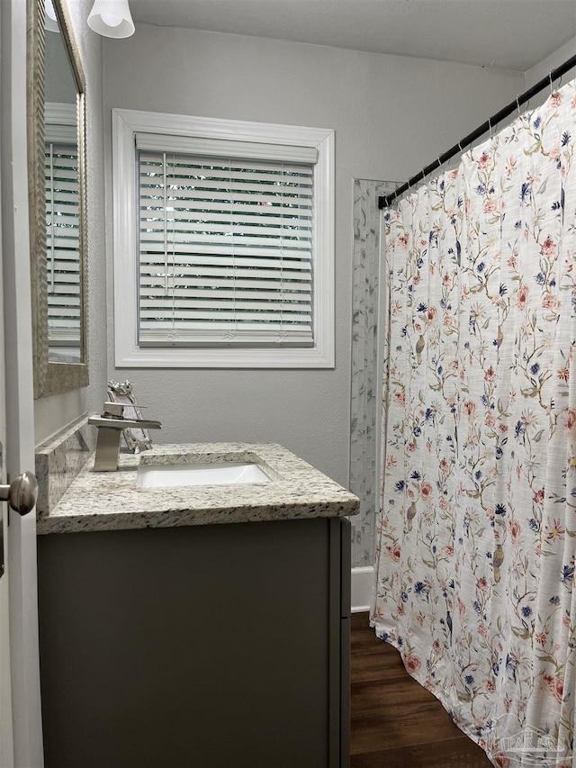 bathroom featuring vanity and wood-type flooring