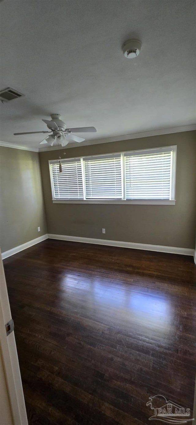 381 Euclid St, Pensacola, FL 32503 - unfurnished room with a ceiling fan, crown molding, dark wood-type flooring, and a smoke detector