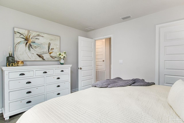 bedroom featuring dark hardwood / wood-style flooring