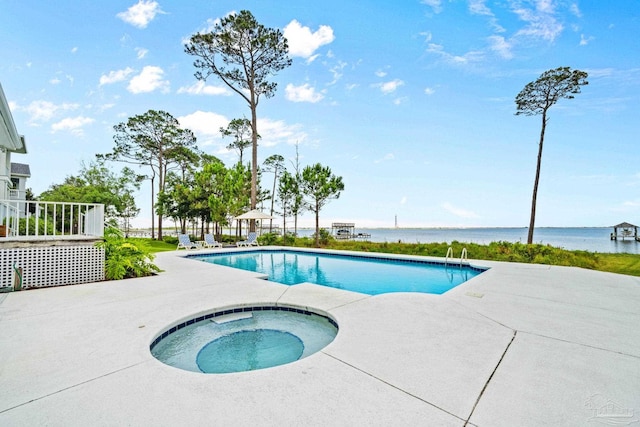 458 Parish Blvd, Mary Esther, FL 32569 - swimming pool featuring a patio, an in-ground hot tub, and a water view