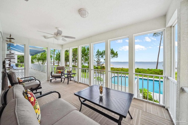 458 Parish Blvd, Mary Esther, FL 32569 - sunroom featuring a ceiling fan, a water view, and plenty of natural light