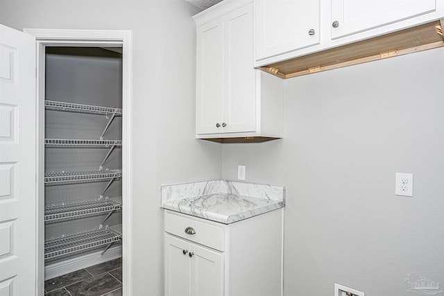 interior space featuring white cabinets