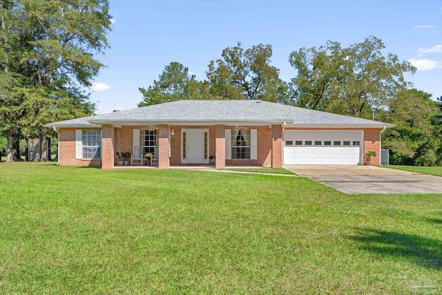 ranch-style home featuring a garage and a front lawn