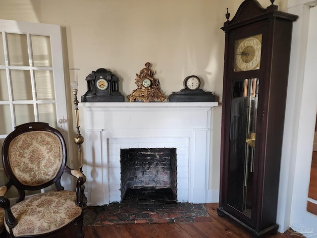 details with hardwood / wood-style floors and a fireplace