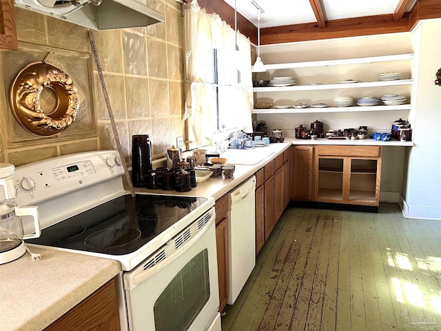 kitchen with pendant lighting, white appliances, dark wood-type flooring, and sink