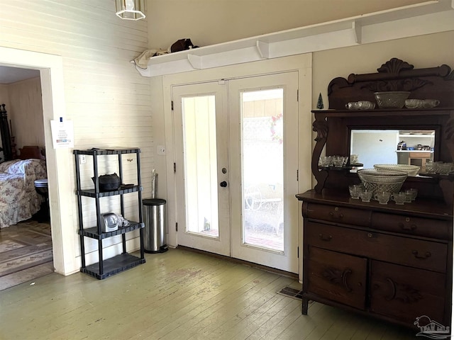 doorway to outside with light hardwood / wood-style flooring and french doors