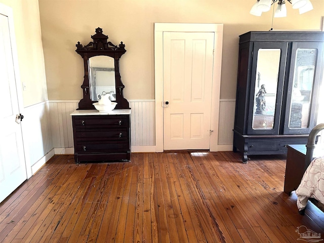 unfurnished bedroom featuring dark hardwood / wood-style flooring