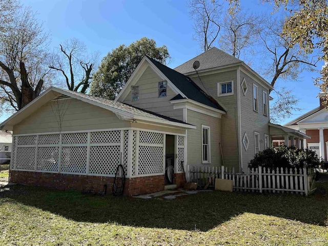 view of home's exterior with a lawn