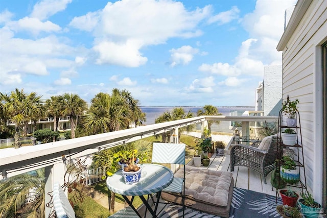 balcony featuring a water view