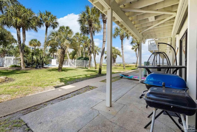 view of patio featuring fence and grilling area