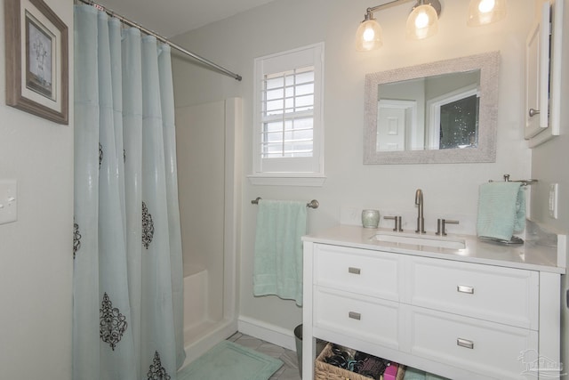 bathroom with vanity and curtained shower