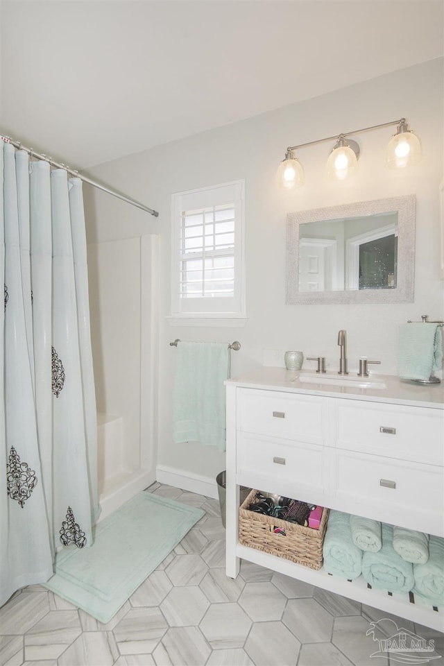 bathroom with vanity and a shower with shower curtain