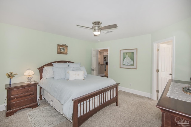 bedroom featuring light carpet and ceiling fan