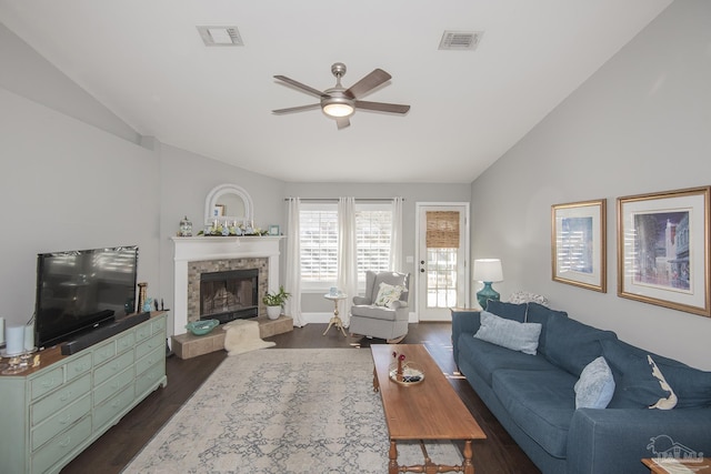 living room featuring ceiling fan, dark hardwood / wood-style floors, and lofted ceiling