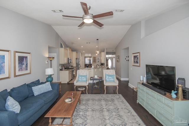 living room with dark wood-type flooring, lofted ceiling, and ceiling fan