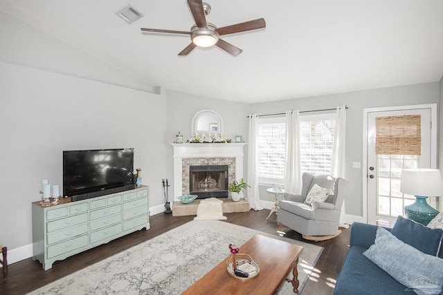 living room featuring vaulted ceiling, ceiling fan, and dark hardwood / wood-style floors