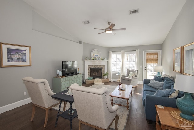 living room with ceiling fan, dark wood-type flooring, and lofted ceiling