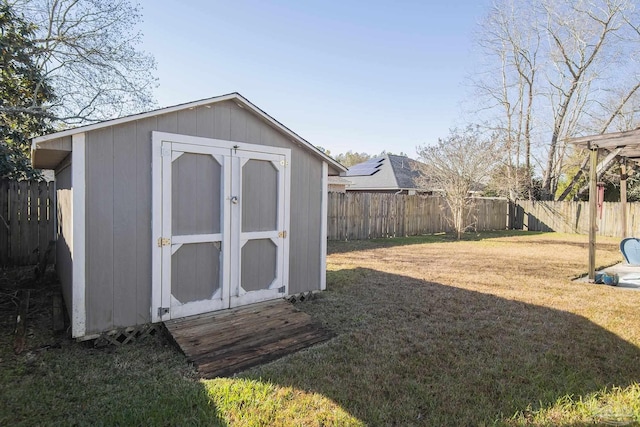 view of outbuilding featuring a yard