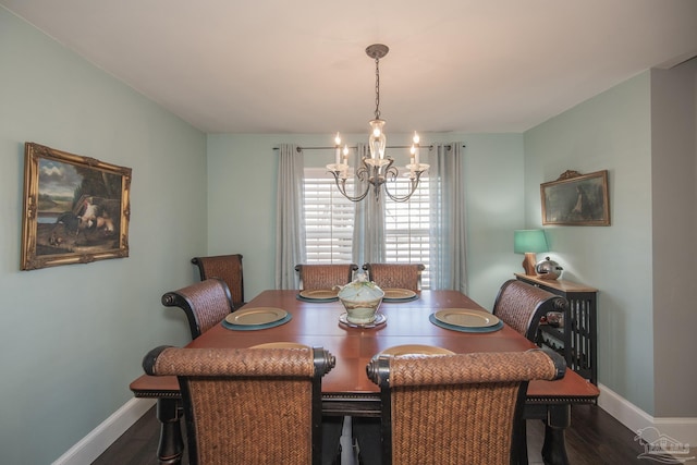 9117 Sebring Dr, Pensacola, FL 32506 - dining room featuring a chandelier, baseboards, and dark wood-type flooring