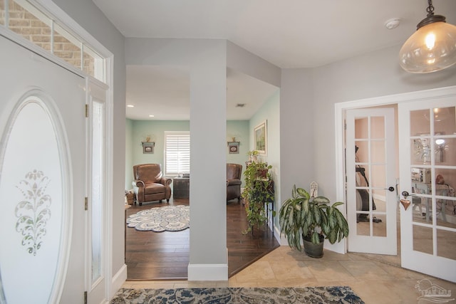 tiled entrance foyer with french doors