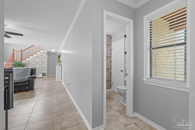 1841 E Smugglers Cove Dr, Gulf Breeze, FL 32563 - hall featuring tile patterned flooring, crown molding, stairway, and baseboards