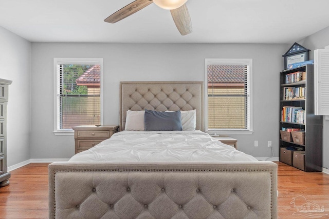 1841 E Smugglers Cove Dr, Gulf Breeze, FL 32563 - bedroom featuring light wood-style floors, baseboards, and ceiling fan