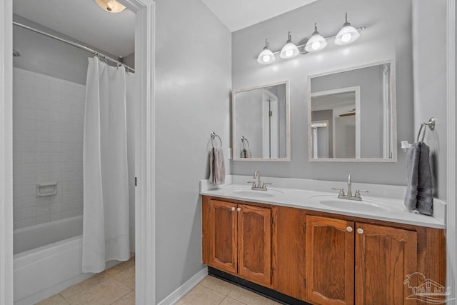 1841 E Smugglers Cove Dr, Gulf Breeze, FL 32563 - full bath with tile patterned flooring, double vanity, shower / bath combo with shower curtain, and baseboards