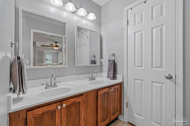 1841 E Smugglers Cove Dr, Gulf Breeze, FL 32563 - full bathroom with double vanity, ceiling fan, and tile patterned floors