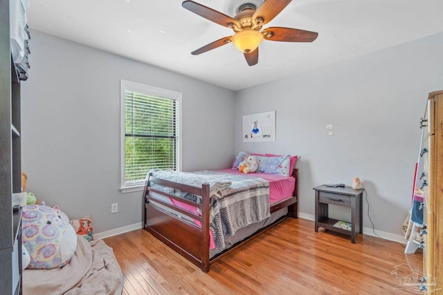 1841 E Smugglers Cove Dr, Gulf Breeze, FL 32563 - bedroom featuring light wood-type flooring, baseboards, and ceiling fan