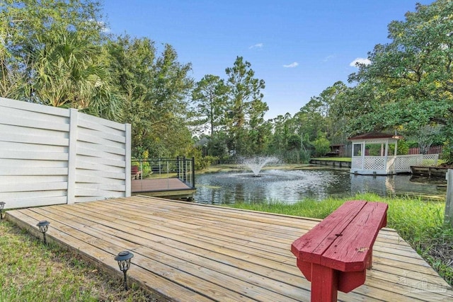 1841 E Smugglers Cove Dr, Gulf Breeze, FL 32563 - wooden deck featuring a water view and view of wooded area