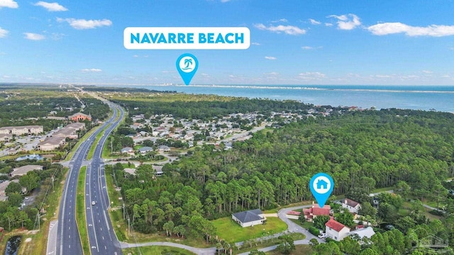 1841 E Smugglers Cove Dr, Gulf Breeze, FL 32563 - aerial view of property's location with a forest, a nearby body of water, and a highway