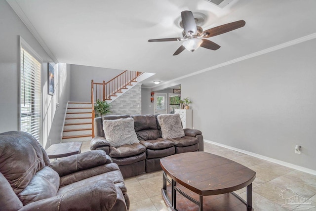 1841 E Smugglers Cove Dr, Gulf Breeze, FL 32563 - living room with stairway, ceiling fan, ornamental molding, baseboards, and lofted ceiling