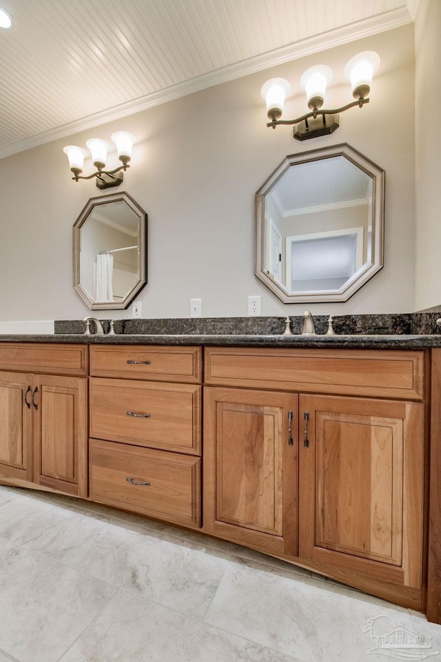 bathroom with double vanity, ornamental molding, a sink, and wood ceiling