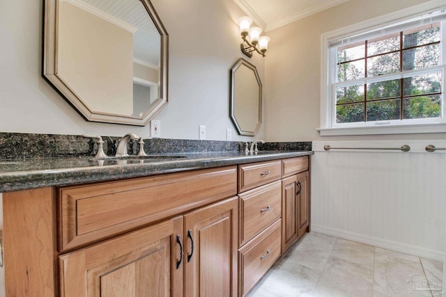 full bath with crown molding, a sink, and double vanity