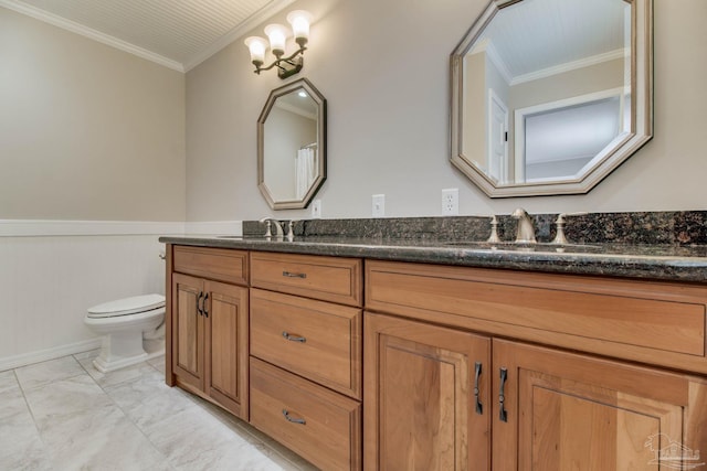 1775 E Texar Dr, Pensacola, FL 32503 - bathroom featuring double vanity, toilet, a wainscoted wall, ornamental molding, and marble look tiles