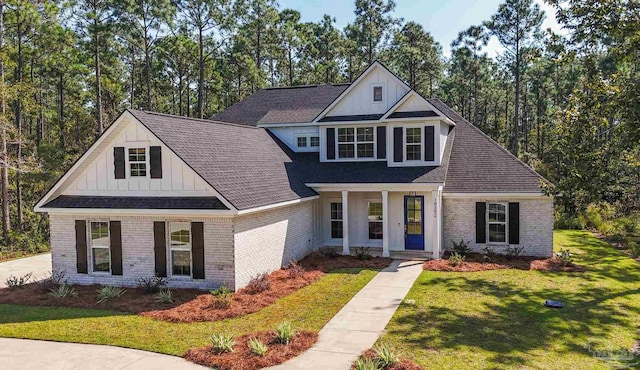 view of front of property with a front yard and a porch