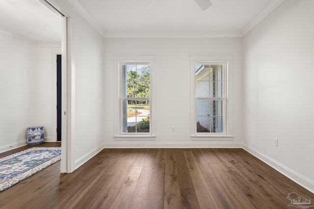 empty room with ornamental molding, dark hardwood / wood-style floors, and ceiling fan