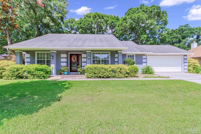 single story home featuring a garage and a front yard