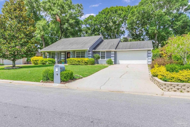 ranch-style house featuring a garage and a front lawn