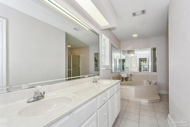 full bathroom featuring a sink, visible vents, a stall shower, and tile patterned flooring